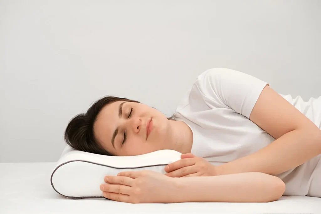 Young woman sleeping peacefully on her side with a supportive pillow — Sleep Medicine Billing Services